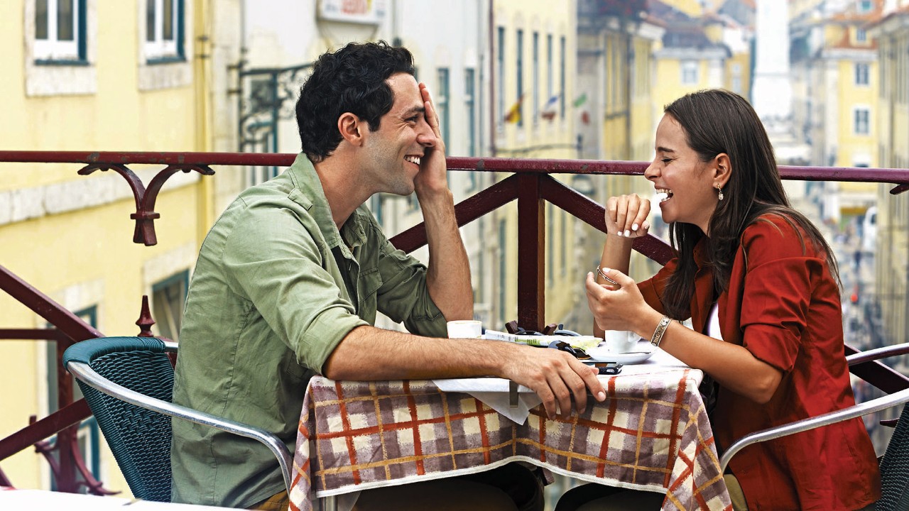 A couple is enjoying a meal together: image used on HSBC Malaysia Individual expertise and support page.