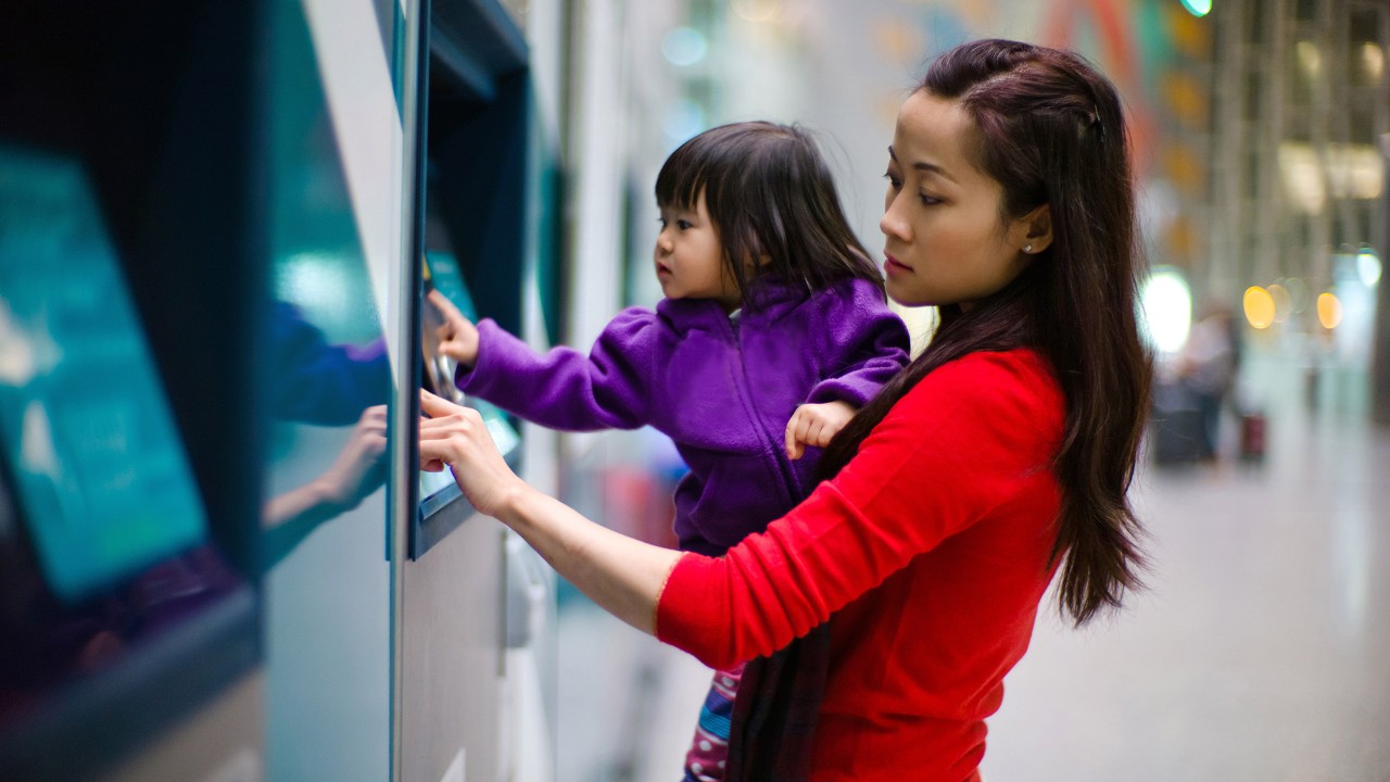 A mother and daughter at an atm; image used for HSBC Malaysia express banking